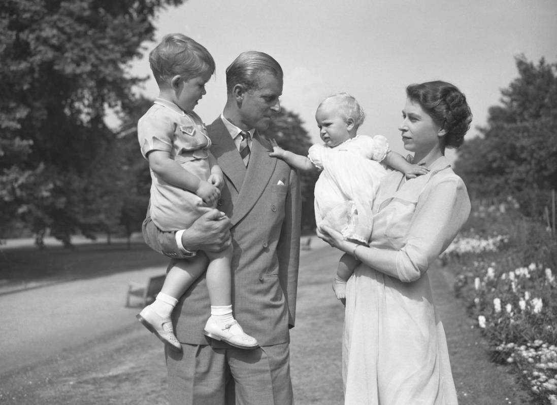 Princess Elizabeth stands with her husband Prince Philip, the Duke of Edinburgh, and their chil ...
