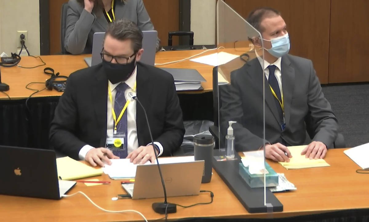 In this image from video, defense attorney Eric Nelson, left, and defendant, former Minneapolis ...