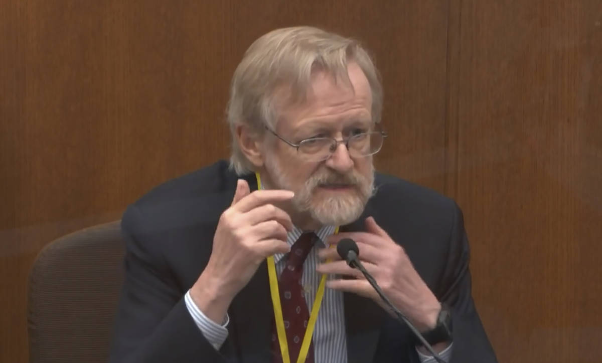 In this image from video, Dr. Martin Tobin testifies as Hennepin County Judge Peter Cahill ...