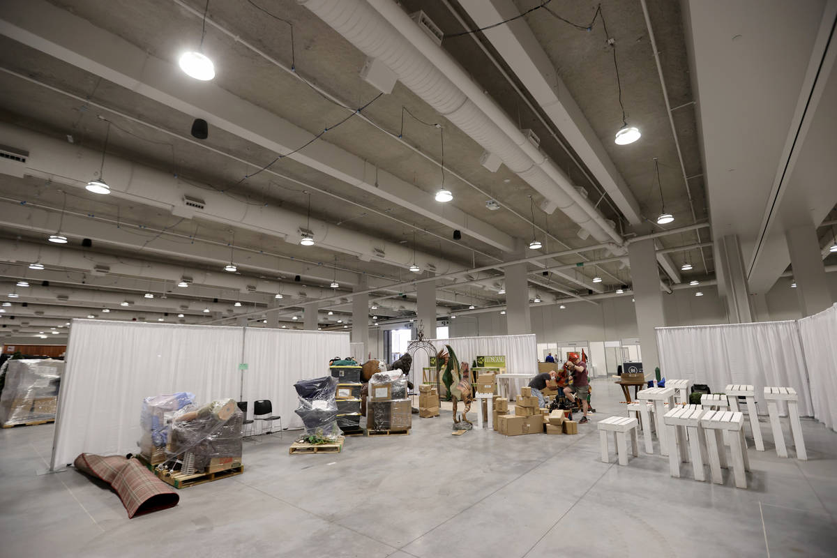 Gift and home temporary exhibitors set up for the Las Vegas Market after a ribbon-cutting cerem ...