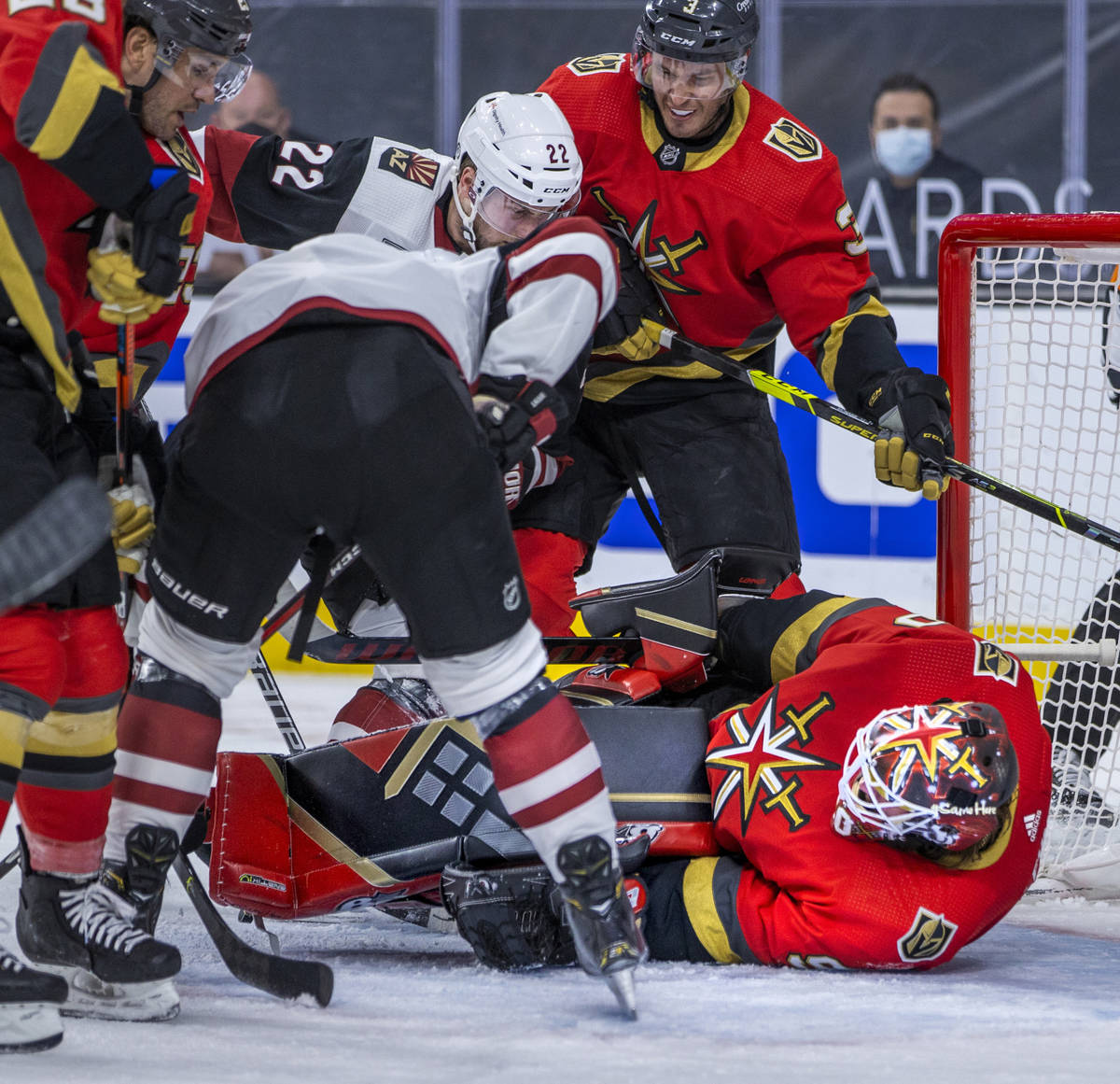 Golden Knights goaltender Robin Lehner (90) goes to the ice defending a shot by Arizona Coyotes ...