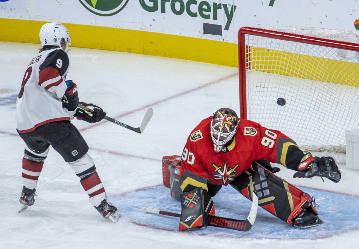 Arizona Coyotes right wing Clayton Keller (9) scores on Golden Knights goaltender Robin Lehner ...