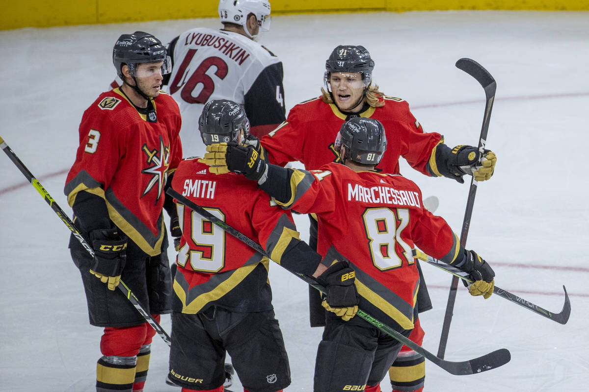 Teammates congratulate Golden Knights right wing Reilly Smith (19) on another goal versus the A ...