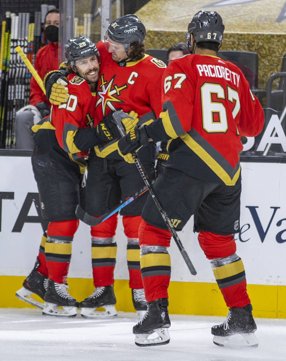Golden Knights center Chandler Stephenson (20) is congratulated on a score by right wing Mark S ...