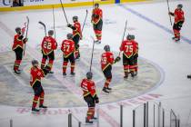 Golden Knights players celebrate with the crowd a 7-4 win over the Arizona Coyotes after the th ...
