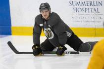 Golden Knights defenseman Brayden Pachal (94) stretches during practice at City National Arena ...