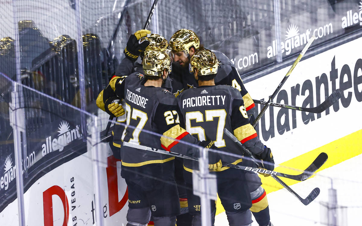 Golden Knights' Tomas Nosek celebrates with teammates after scoring against the Arizona Coyotes ...