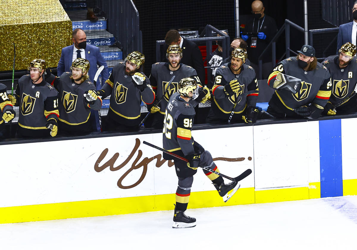 Golden Knights' Tomas Nosek (92) celebrates with teammates after scoring against the Arizona Co ...