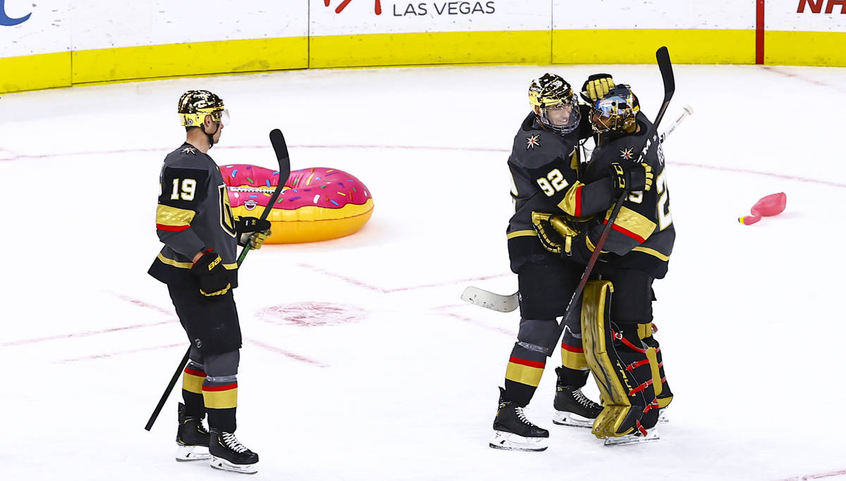 Golden Knights' Tomas Nosek (92) celebrates with goaltender Marc-Andre Fleury (29) after a shu ...
