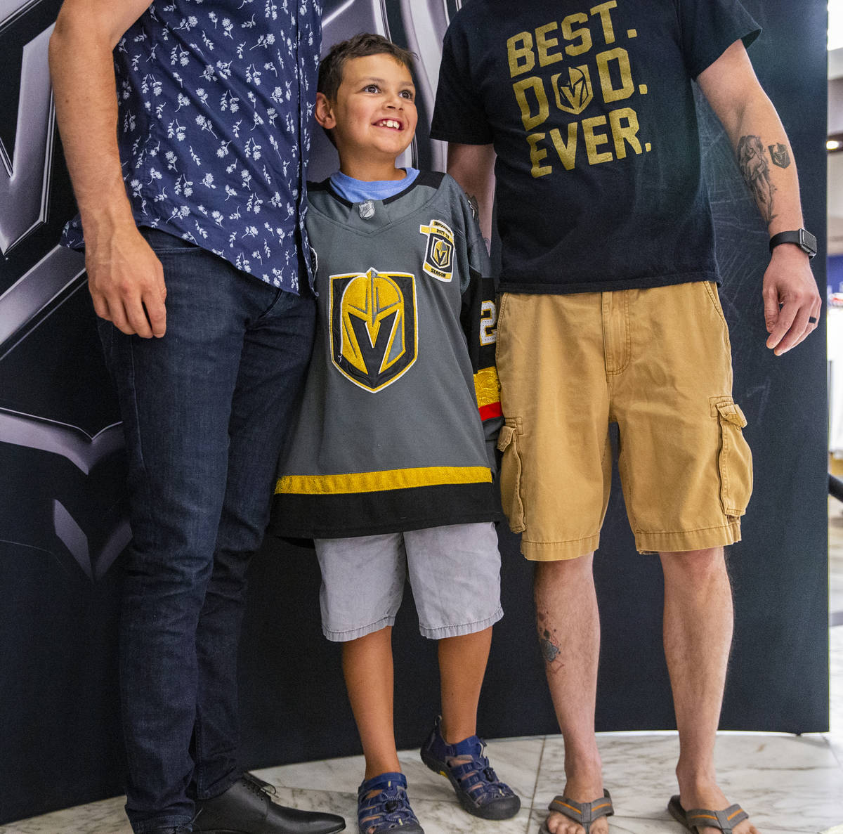 Young Golden Knights fan Jordyn Weatherholt, 9, is pleased to be standing between NHL player Ma ...