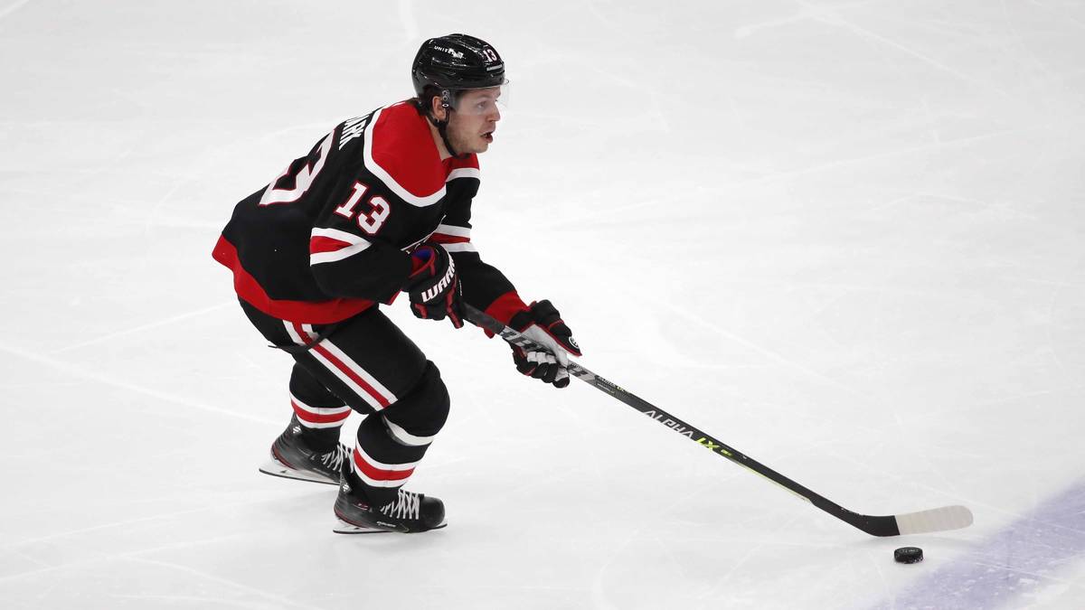 Chicago Blackhawks center Mattias Janmark (13) shoots the puck against the Dallas Stars during ...