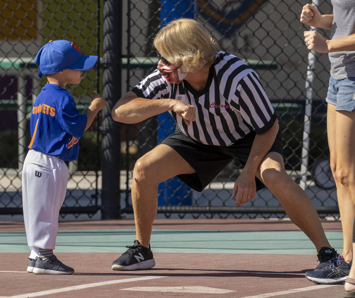 Batter Ryzer ÒRyzÓ Watson, 3, greets umpire Carrie OÕDea during a Miracle League ...