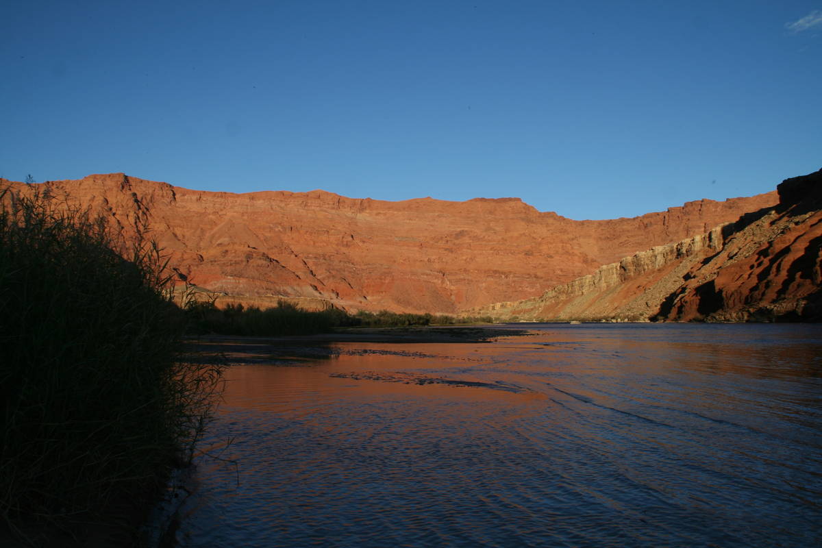 The sandstone cliffs become take on a rich glowing orange hue during sunsets at Lees Ferry. (De ...