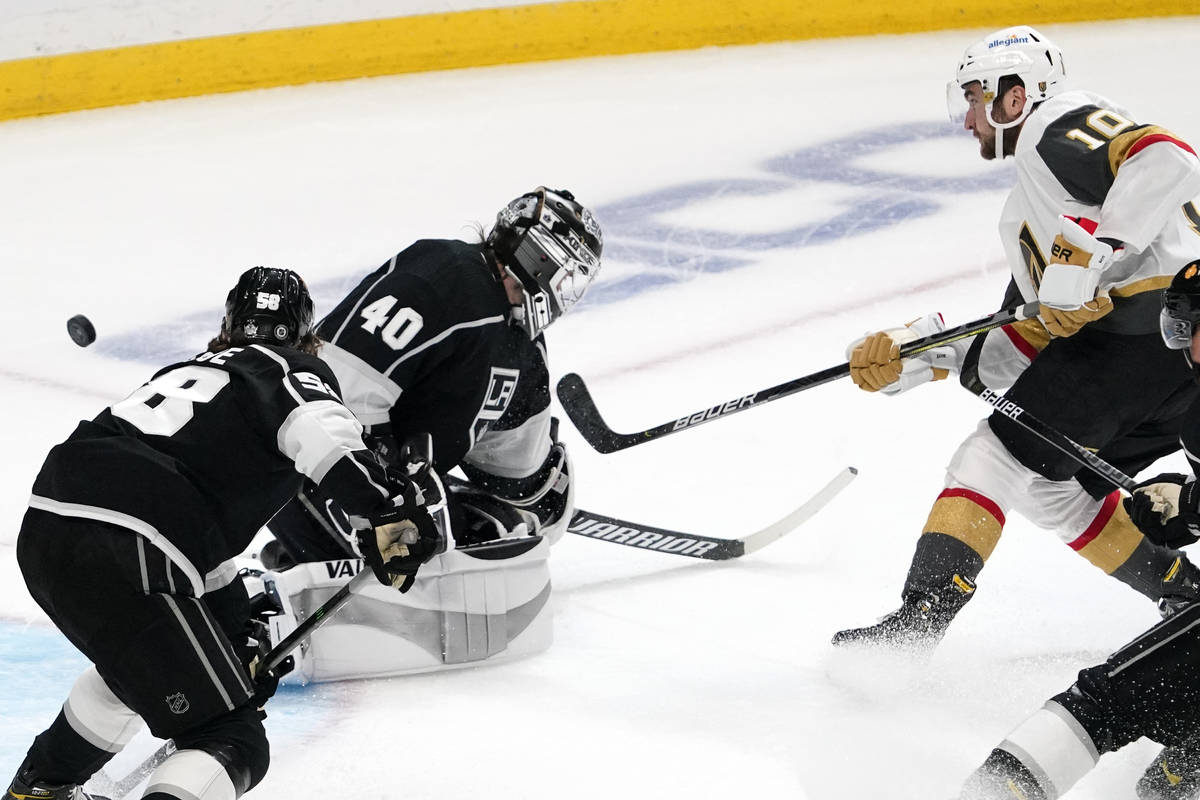 Vegas Golden Knights center Nicolas Roy, right, scores on Los Angeles Kings goaltender Calvin P ...