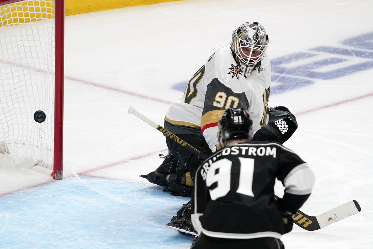 Vegas Golden Knights goaltender Robin Lehner, top, deflects a shot as Los Angeles Kings left wi ...