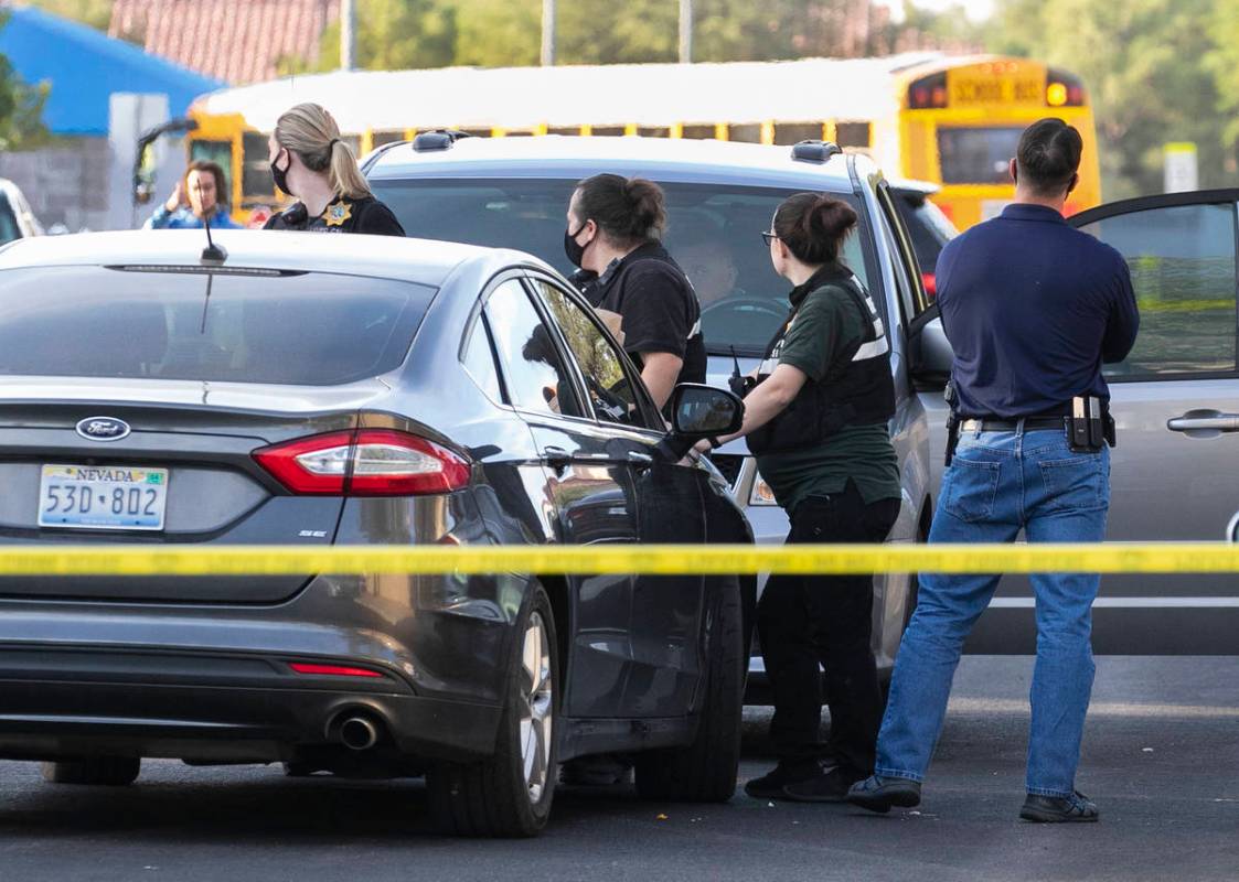 The Metropolitan Police Department investigate the fatal shooting of a young man outside a hous ...