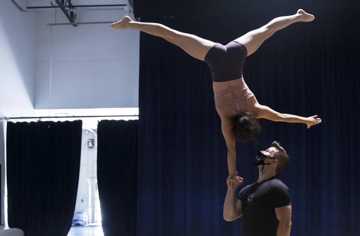 Hand to hand acrobatic duo Marie-Lee Guilbert, top/left, and Philippe Blanger rehearse for "Ign ...
