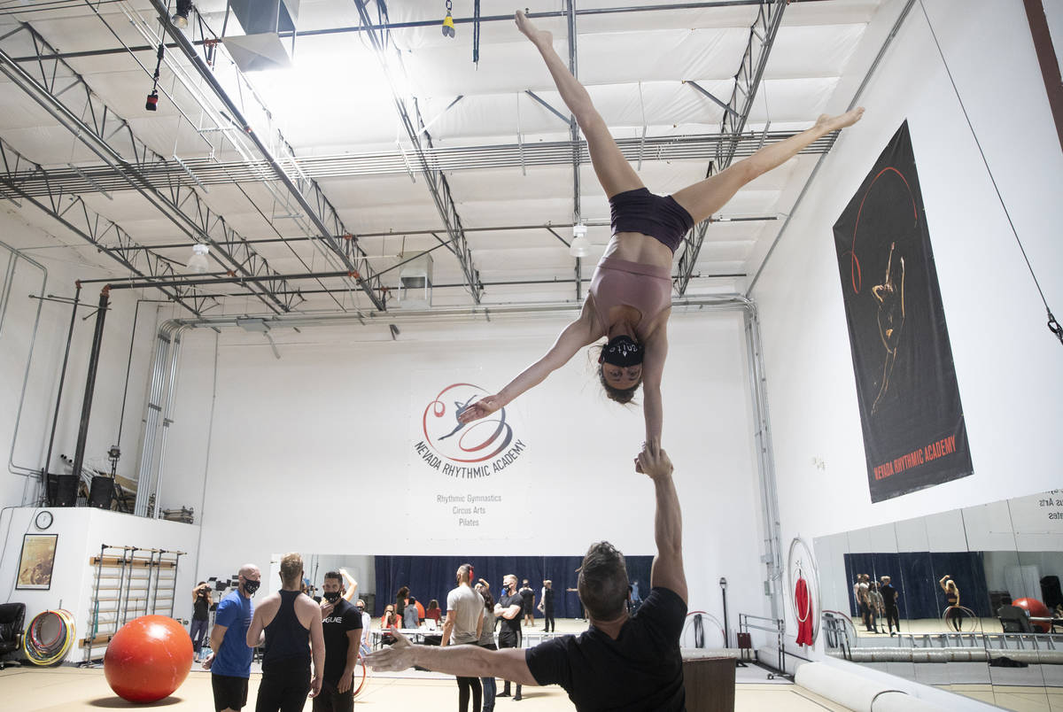 Hand to hand acrobatic duo Marie-Lee Guilbert, top/right, and Philippe Blanger rehearse for "Ig ...
