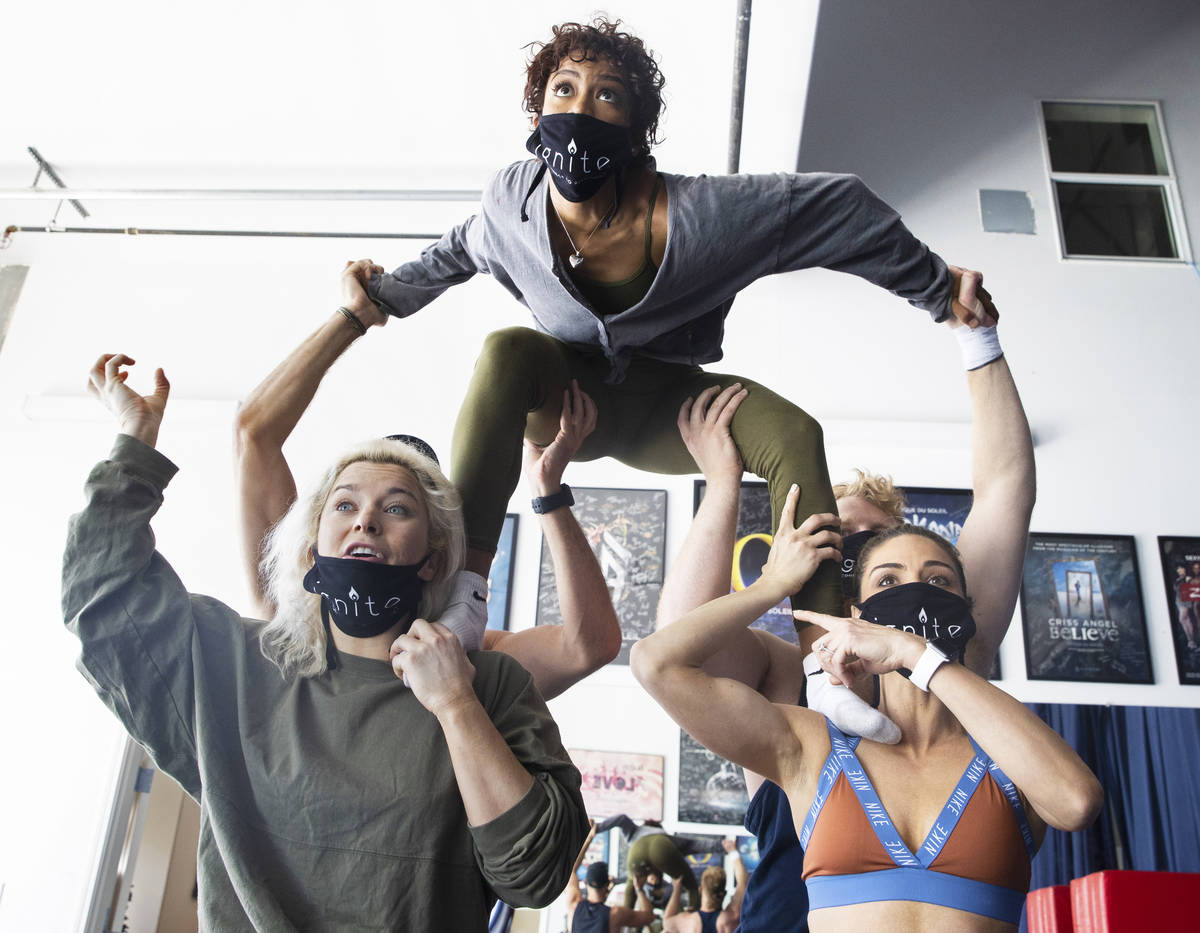 Allison Burke, bottom/left, Tiffany de Alba, Marina Pegado and Wyatt Hopkins rehearse for "Igni ...