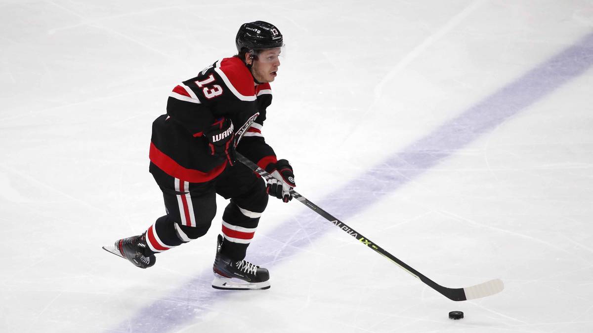 Chicago Blackhawks center Mattias Janmark (13) shoots the puck against the Dallas Stars during ...