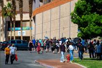 People wait in line at the COVID-19 vaccination site at Cashman Center in Las Vegas on Tuesday, ...