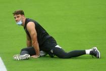 Las Vegas Raiders linebacker Tanner Muse warms up prior to a team practice at Allegiant Stadium ...