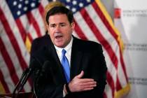 In this Dec. 2, 2020, file photo, Arizona Republican Gov. Doug Ducey answers a question during ...