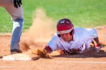 Arbor View's Tyler Whitaker slides in safe at first during the second inning while playing agai ...