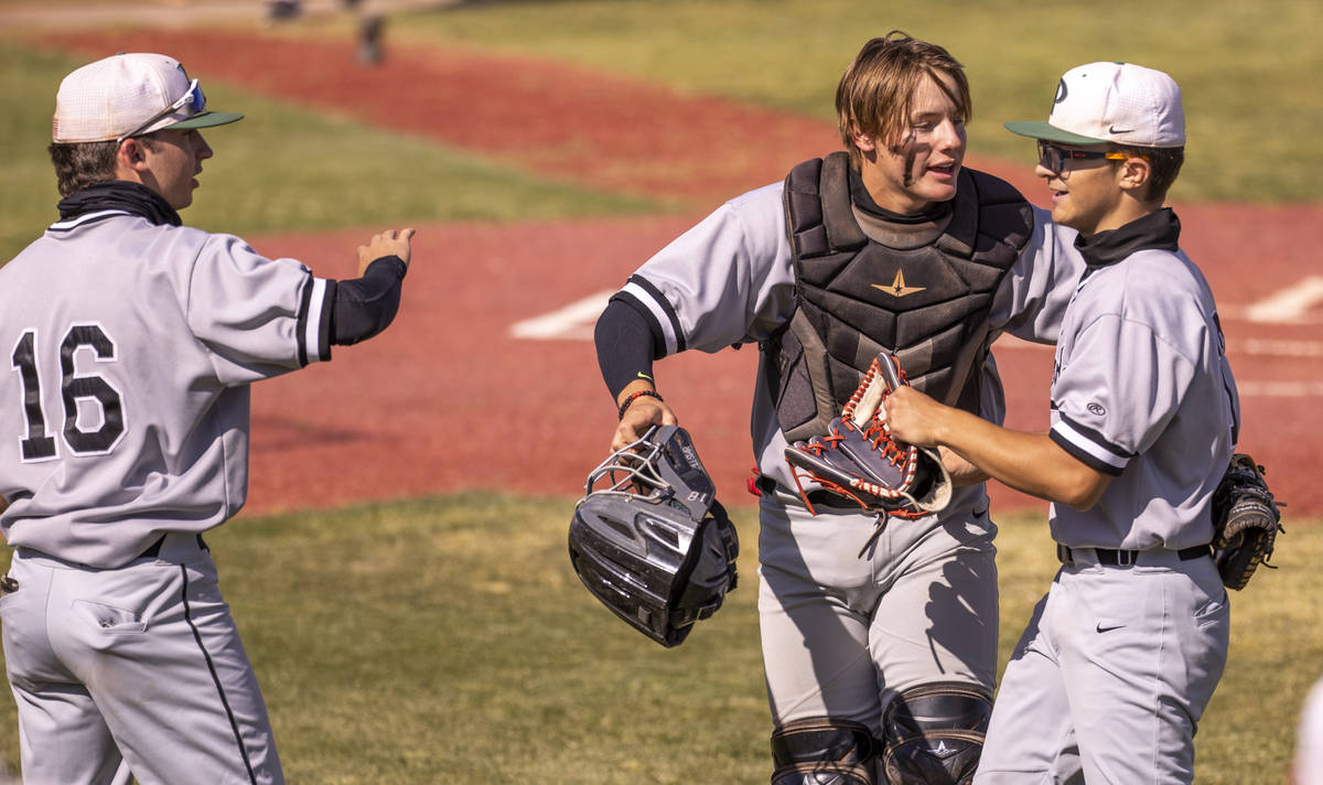 Palo Verde Jacob Gonzalez pitcher (12, right) is pumped up by catcher Aric Anderson (19) after ...