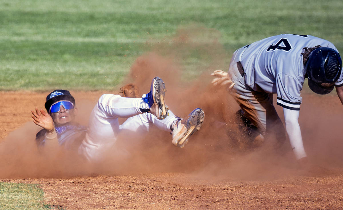 Basic 2B Ty Southisene (3) is knocked to the dirt but makes the out on Palo Verde runner Cal Er ...