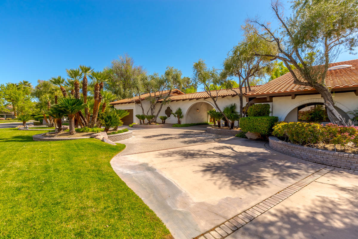 A view of the front yard reveals the property's mature vegetation. (Fraser Almeida/Luxury Homes ...