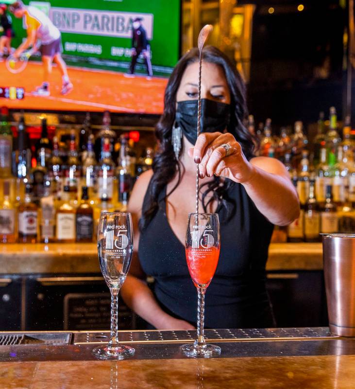 Bartender Lianne Garris stirs an anniversary cocktail in the Lobby Bar at Red Rock Resort. (L.E ...