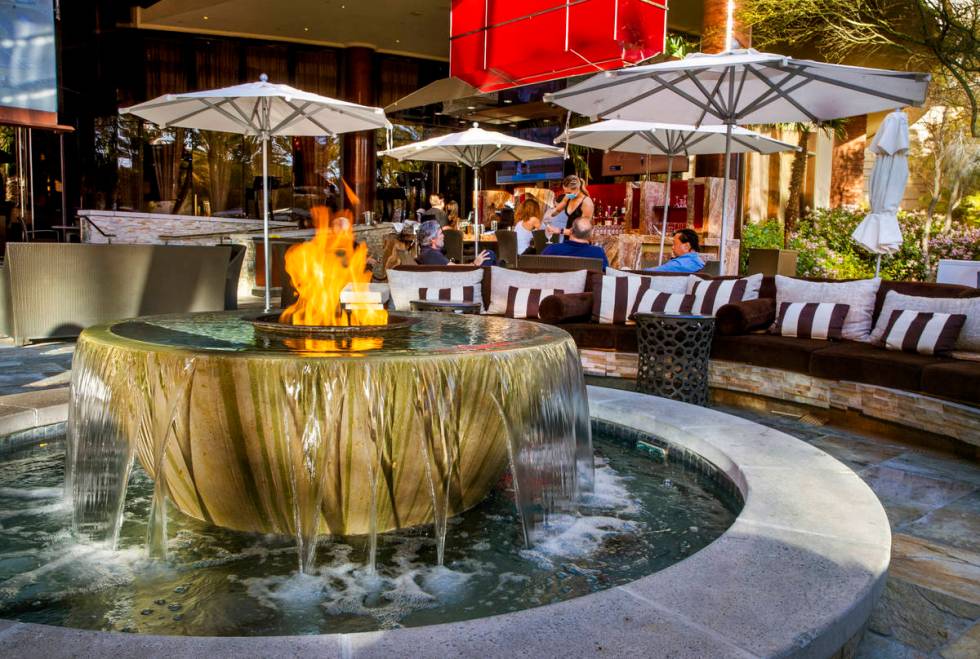 Visitors can relax near the fountain with a flame near the pool at Red Rock Resort. (L.E. Basko ...