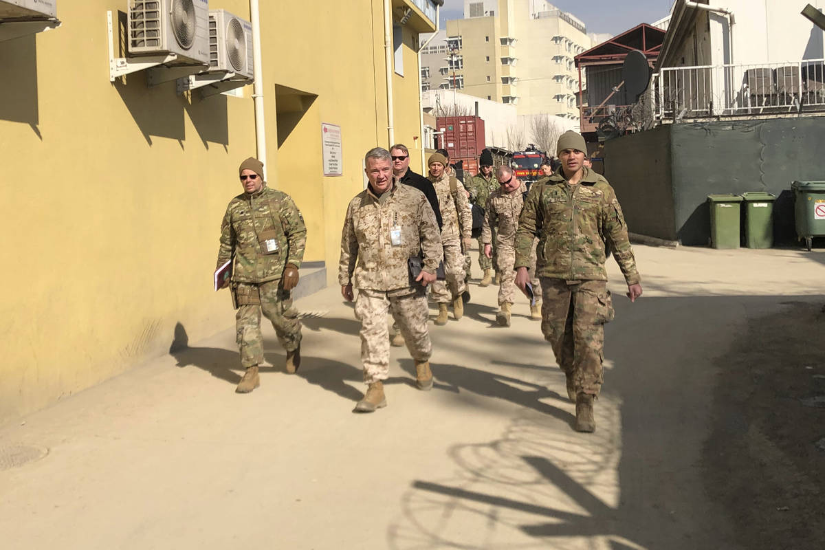 In this Jan. 31, 2020, file photo Marine Gen. Frank McKenzie, center, top U.S. commander for th ...