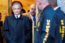 FILE - Disgraced financier Bernard Madoff leaves U.S. District Court in Manhattan after a bail ...