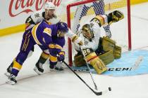 Los Angeles Kings left wing Andreas Athanasiou (22), defenseman Alex Pietrangelo (7) and goalte ...