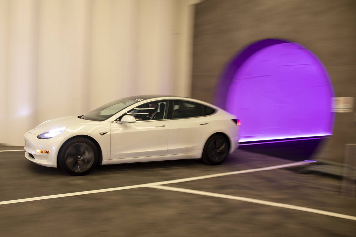 A Tesla electric car enters Central Station of the Boring Company’s Convention Center Lo ...