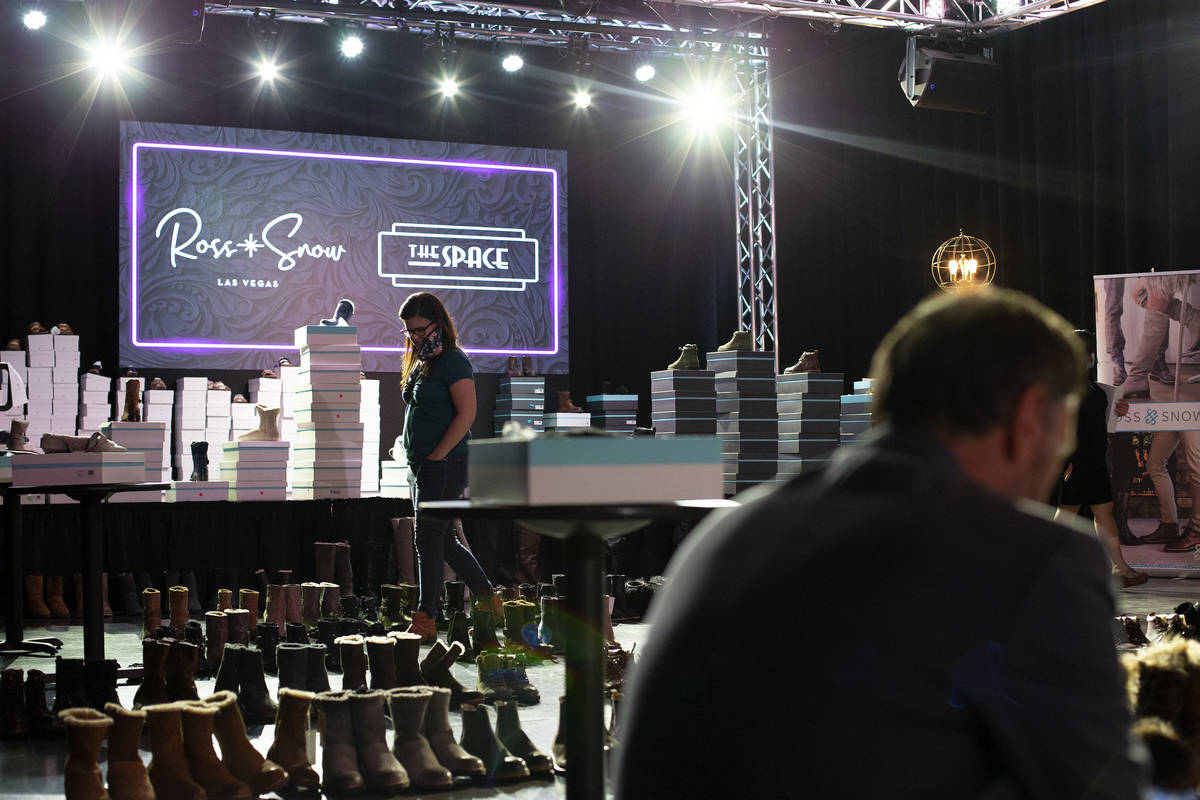 Shoppers browse at Vegas-based footwear brand Ross & Snow's pop-up sale at The Space on Wed ...