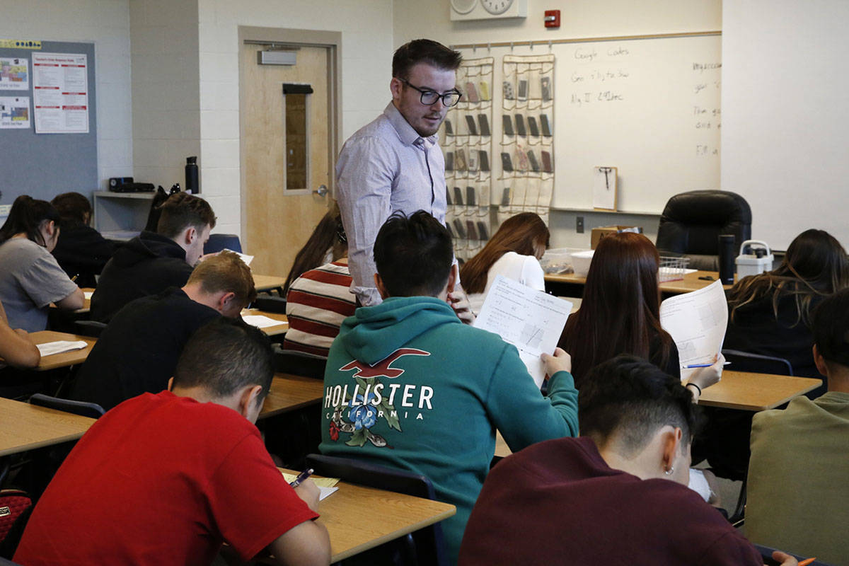 Spencer Skees, Desert Oasis High School math teacher supervises his student's test Thursday, Au ...