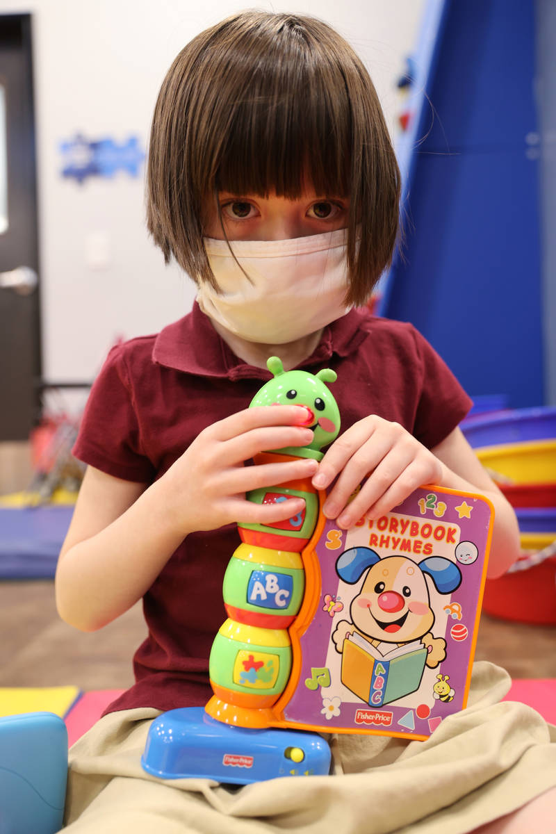 Akara Haase, 6, poses for a portrait in a learning and play area called The Park at the Center ...
