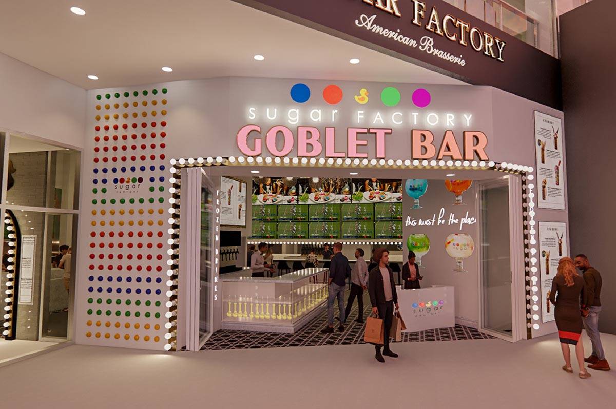 A rock wall made out of candy is one of the attractions at the goblet bar of the Sugar Factory ...