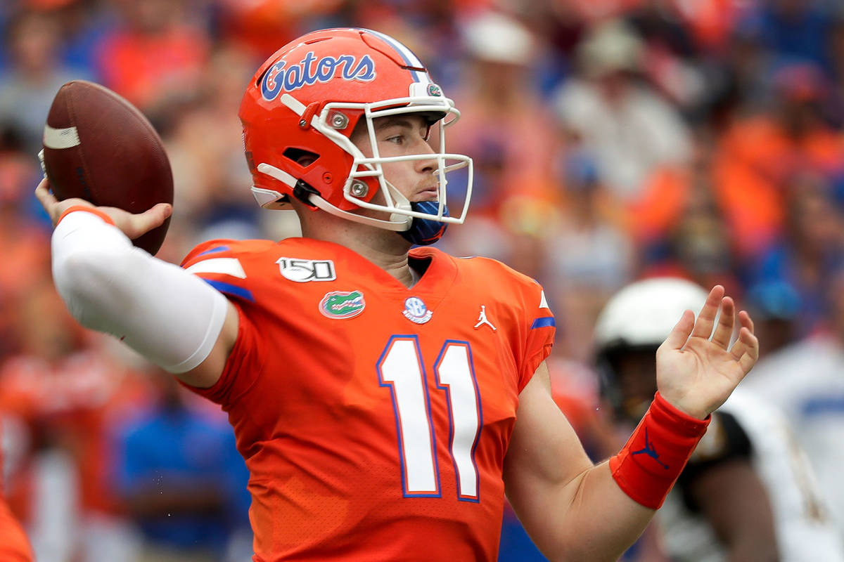 Florida quarterback Kyle Trask throws a pass against Towson during the first half of an NCAA co ...