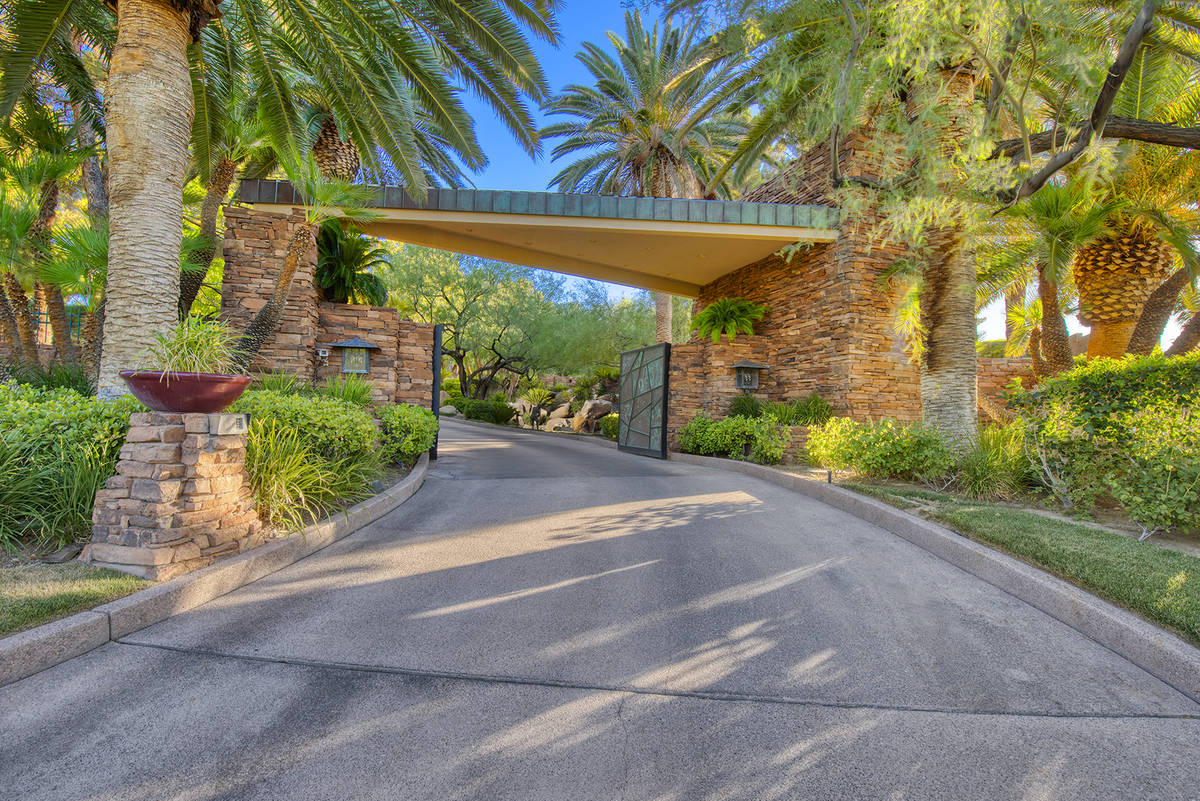 The home on Enclave Court in the exclusive Country Club Hills in Summerlin has its own gate for ...