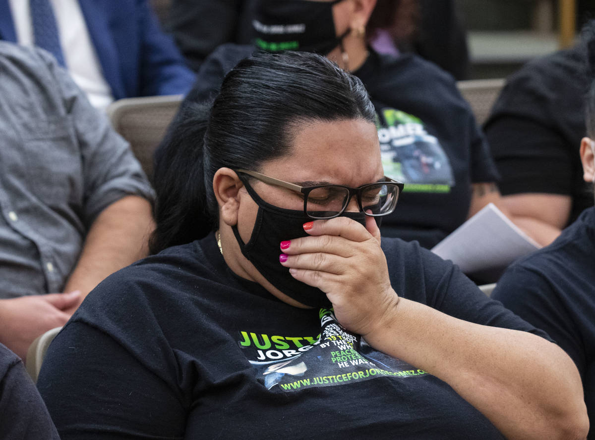 Sulay Lugo reacts as she attends a public fact-finding review for fatal officer involve shootin ...