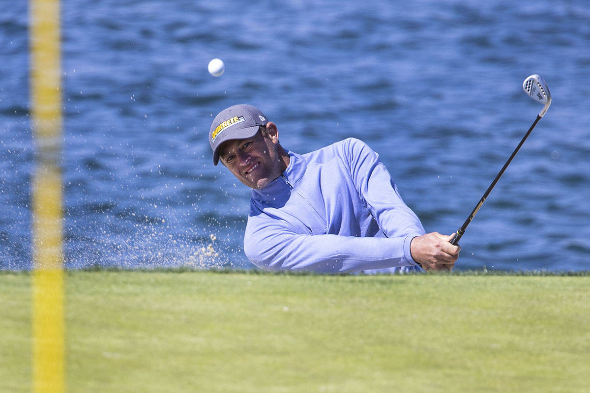 Jamie Arnold of Sydney, Australia, hits out of a bunker on the fourth hole during the first ro ...