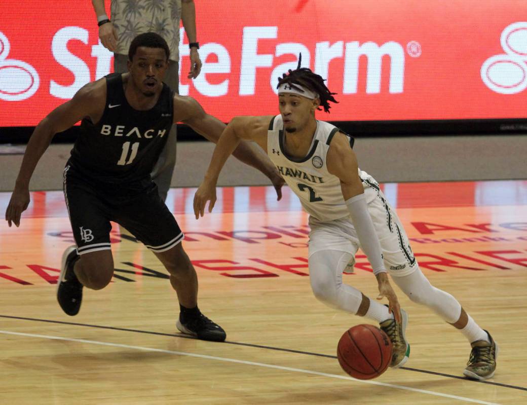 February 26, 2021 - Hawaii Rainbow Warriors guard Justin Webster #2 dribbles past Long Beach St ...