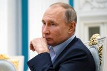 In this Thursday, March 4, 2021, file photo, Russian President Vladimir Putin listens during a ...