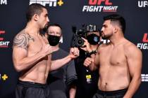 Opponents Robert Whittaker of Australia (left) and Kelvin Gastelum face off during the UFC weig ...