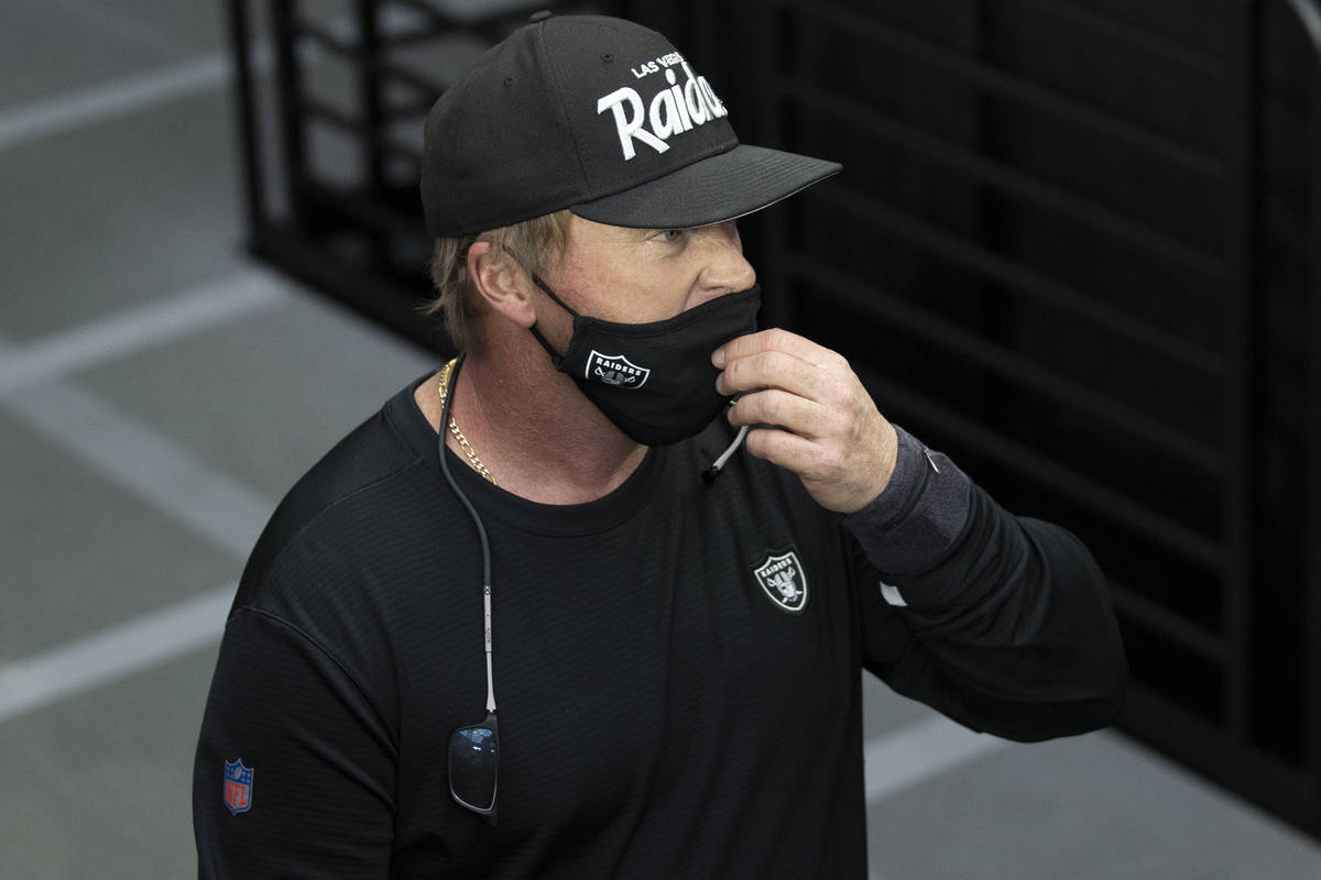 Raiders head coach Jon Gruden takes the field during warm ups before the start of an NFL footba ...