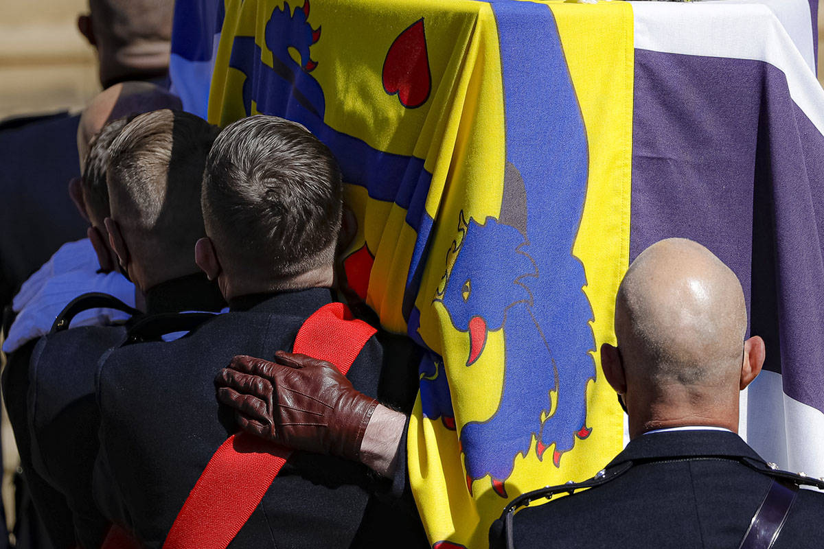 The coffin is carried inside the St George's Chapel for the funeral of Britain's Prince Philip ...